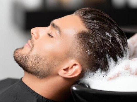 Stylist giving a precision haircut